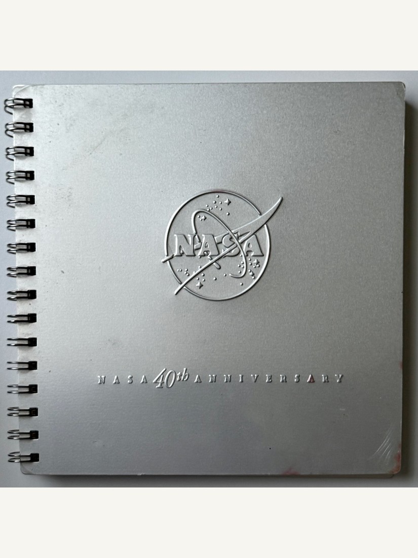 NASA 40th Anniversary commemorative book, spiral-bound with embossed metallic silver covers, 1998