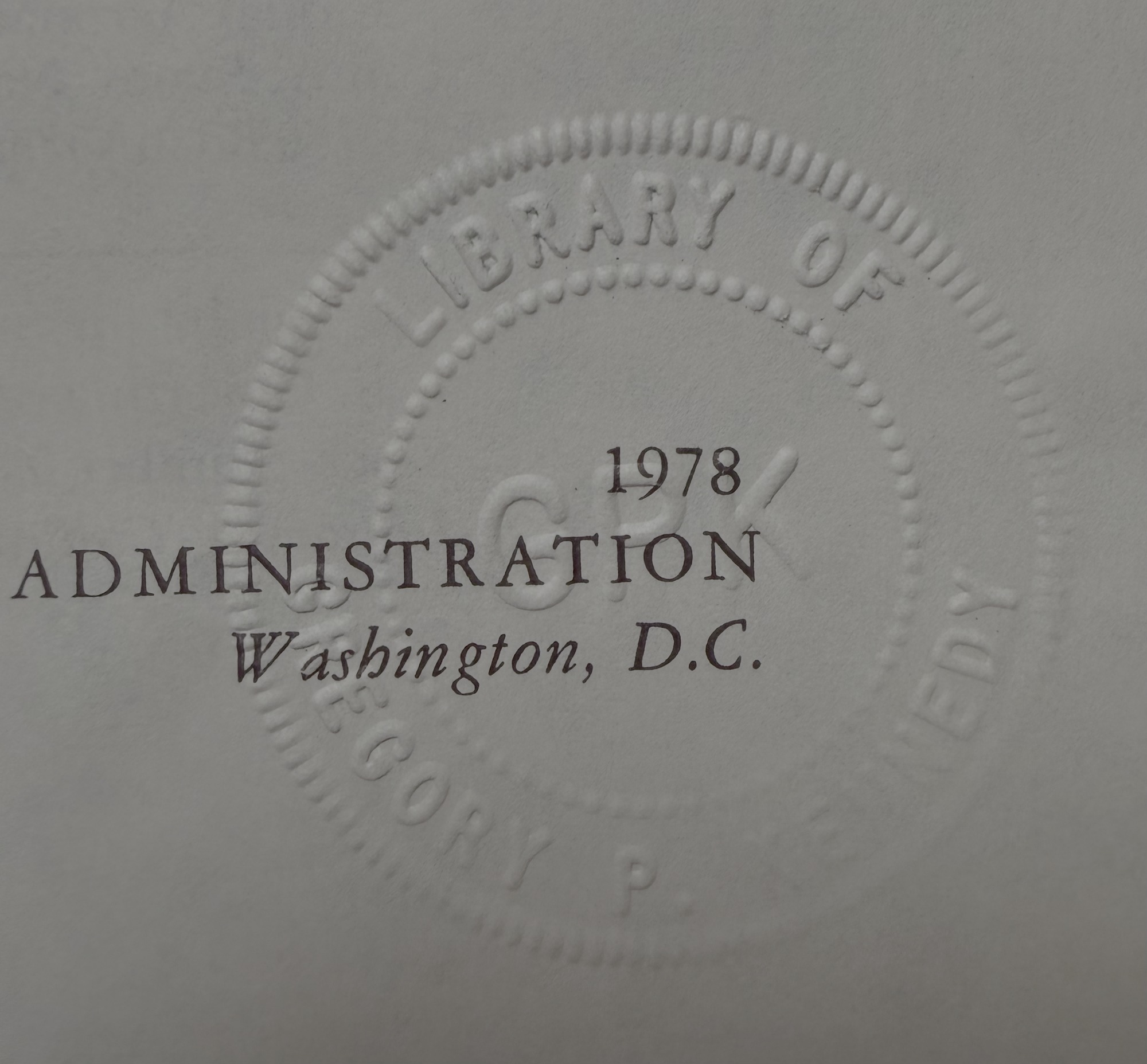 Blind-embossed library stamp of Gregory P. Kennedy, dated 1978, over the printed NASA imprint block