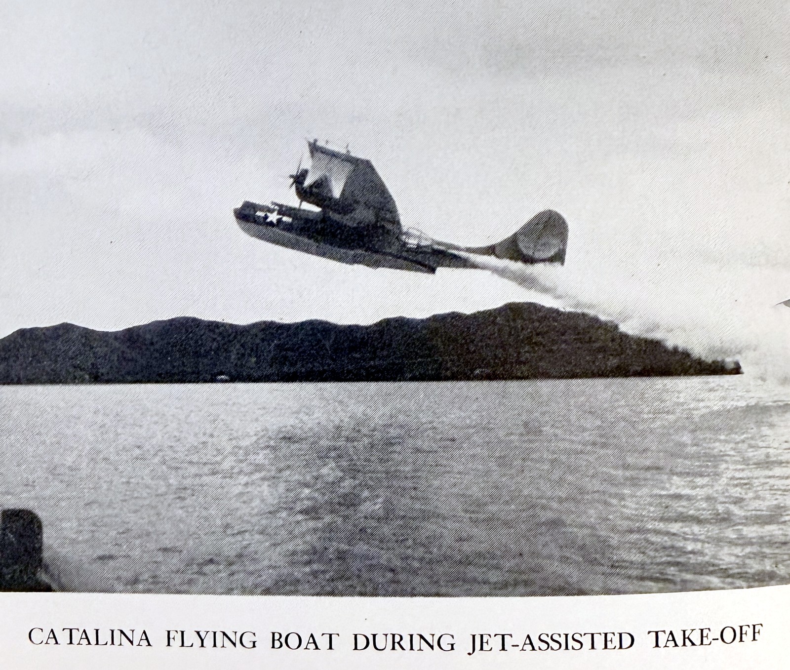 Catalina flying boat during jet-assisted take-off, trailing smoke